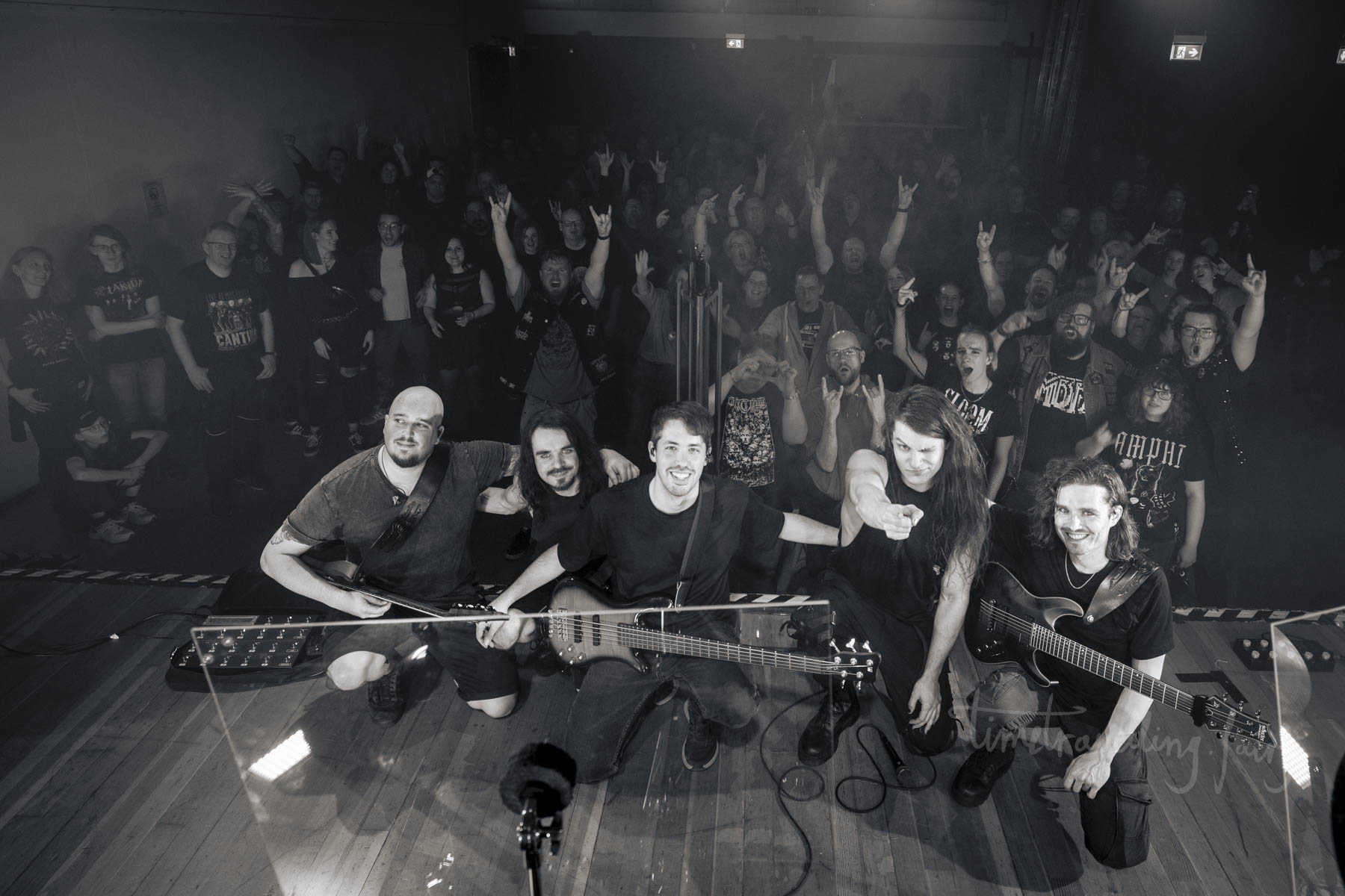 Calibre Infinite with the crowd in a black-and-white live shot